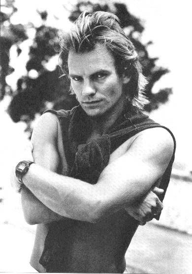 A black and white photograph of the musician, Sting.